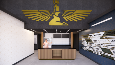 Architectural rendering of the lobby of the revitalized Isis Theatre in Crete, Nebraska. A golden representation of the ancient Egyptian goddess Isis is prominently featured on the wall above a bronze art deco sales and concessions counter. A blue wall with a gold art deco motif to the left displays the names of donors and a wall on the right is painted white with the same gold art deco motif. Doors on either side of the wall behind the counter lead to the theater and other amenities. 